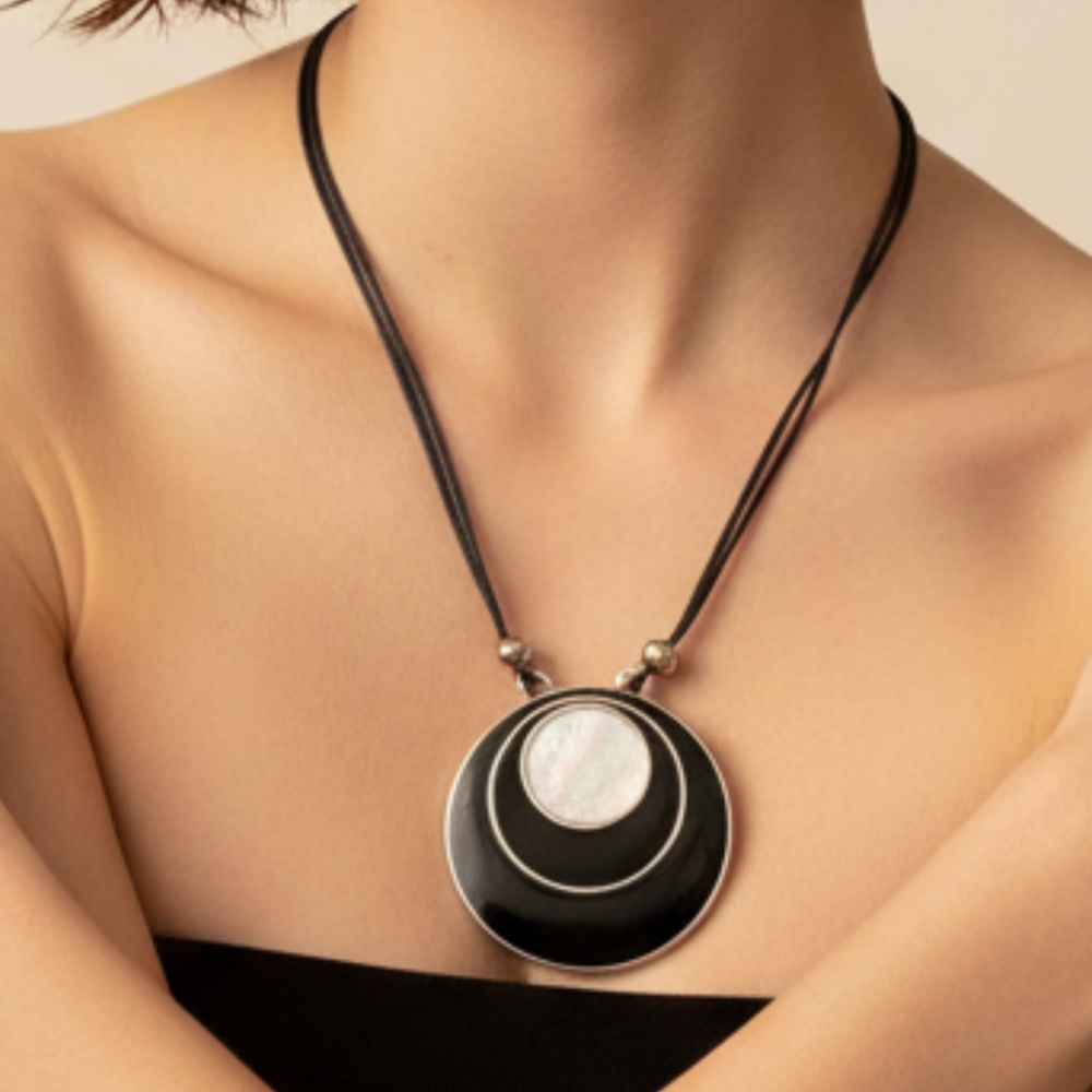 Shell pendant on cord - reversible